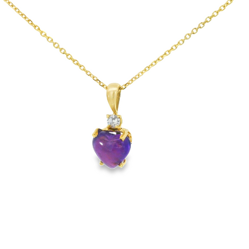Gold necklace with a heart-shaped purple gemstone pendant on a white background