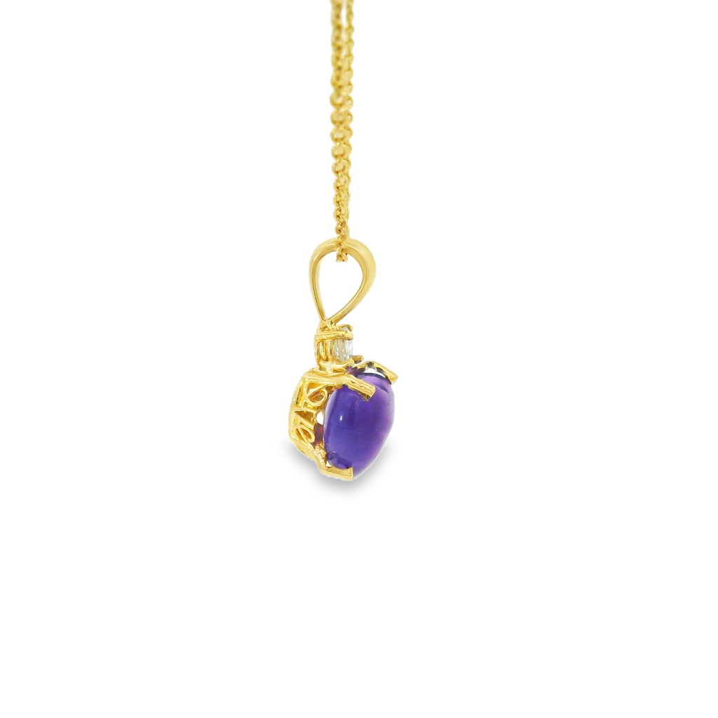 Gold necklace with a purple pendant on a white background