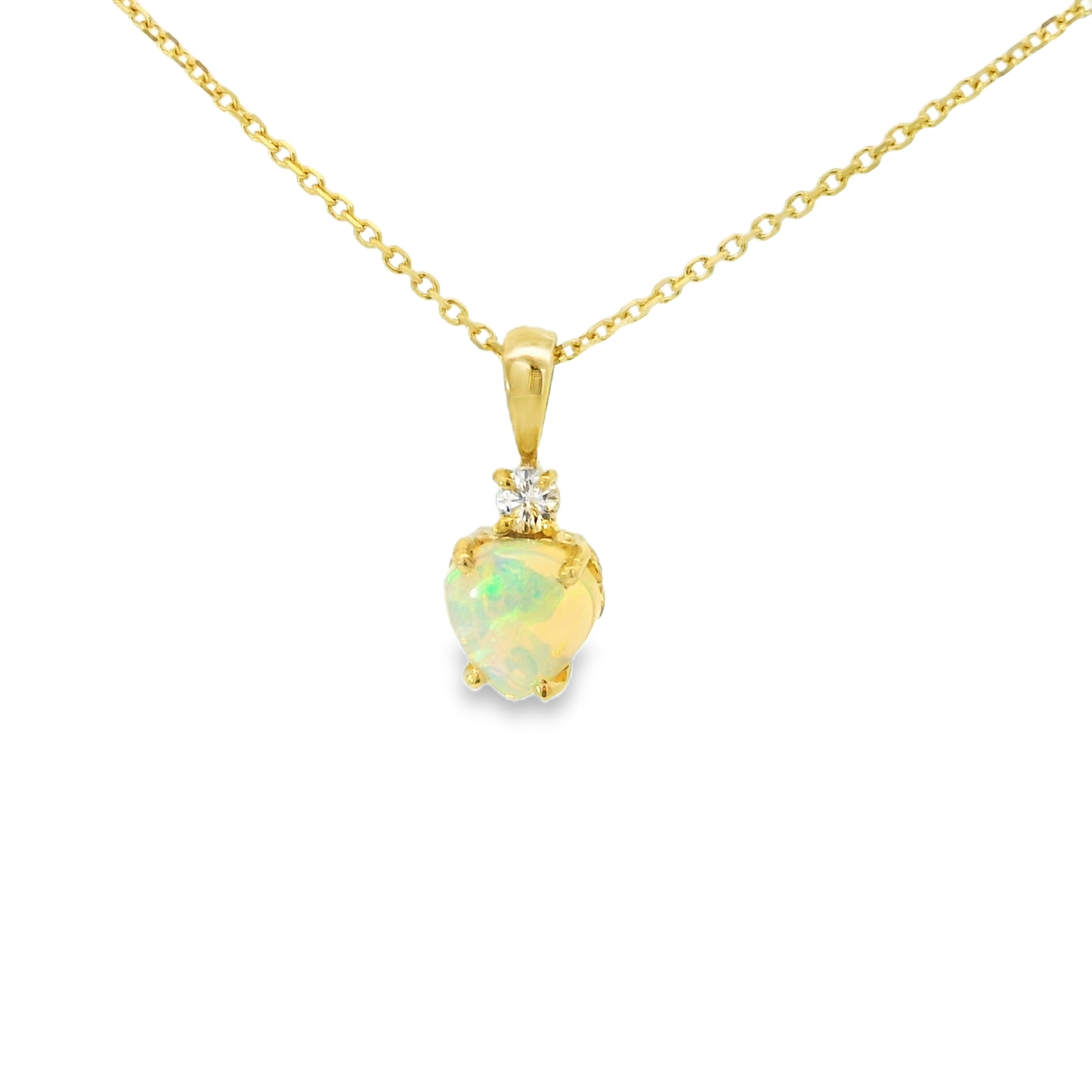 Gold necklace with a heart-shaped opal pendant on a white background