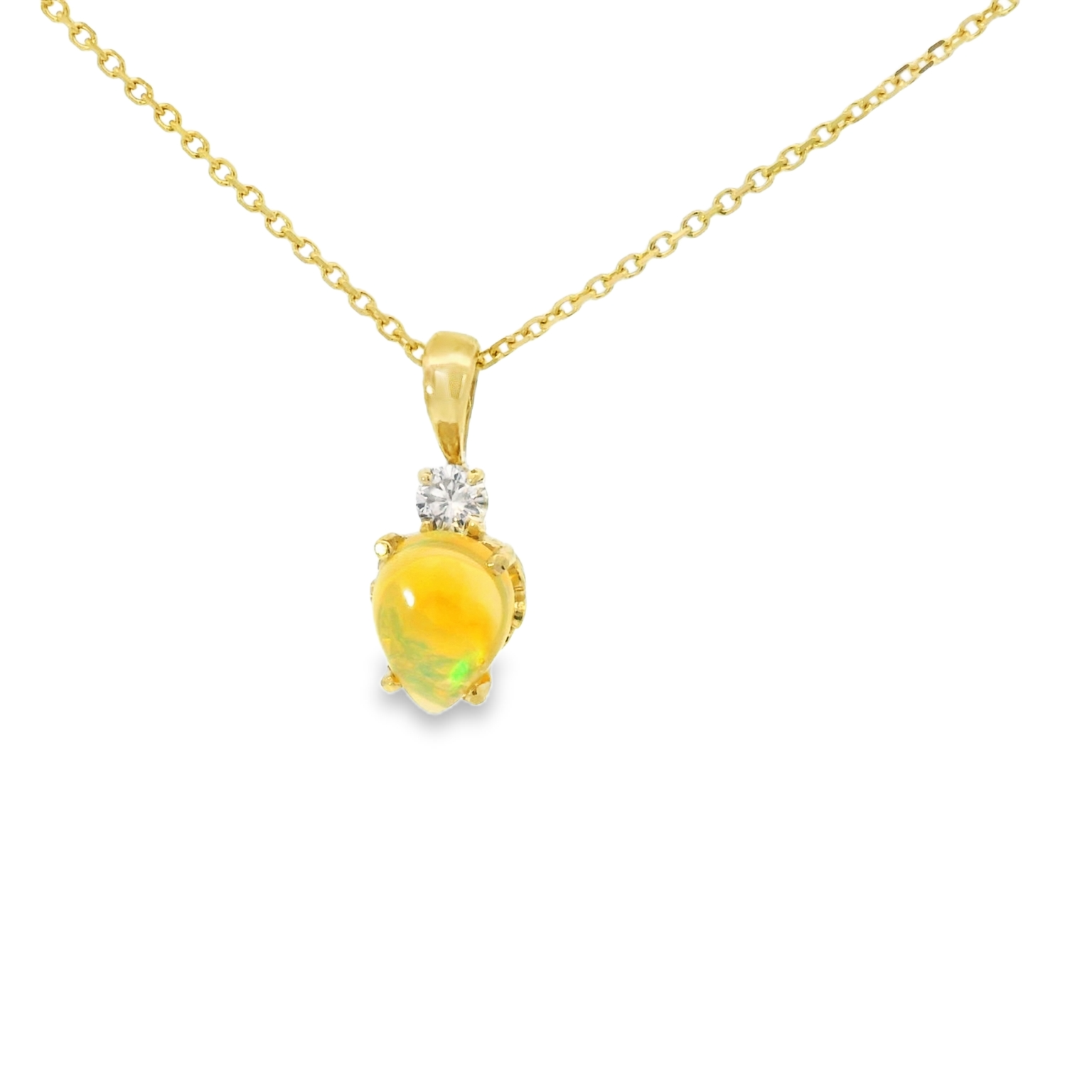 Gold necklace with a opal gemstone pendant and diamond on a white background