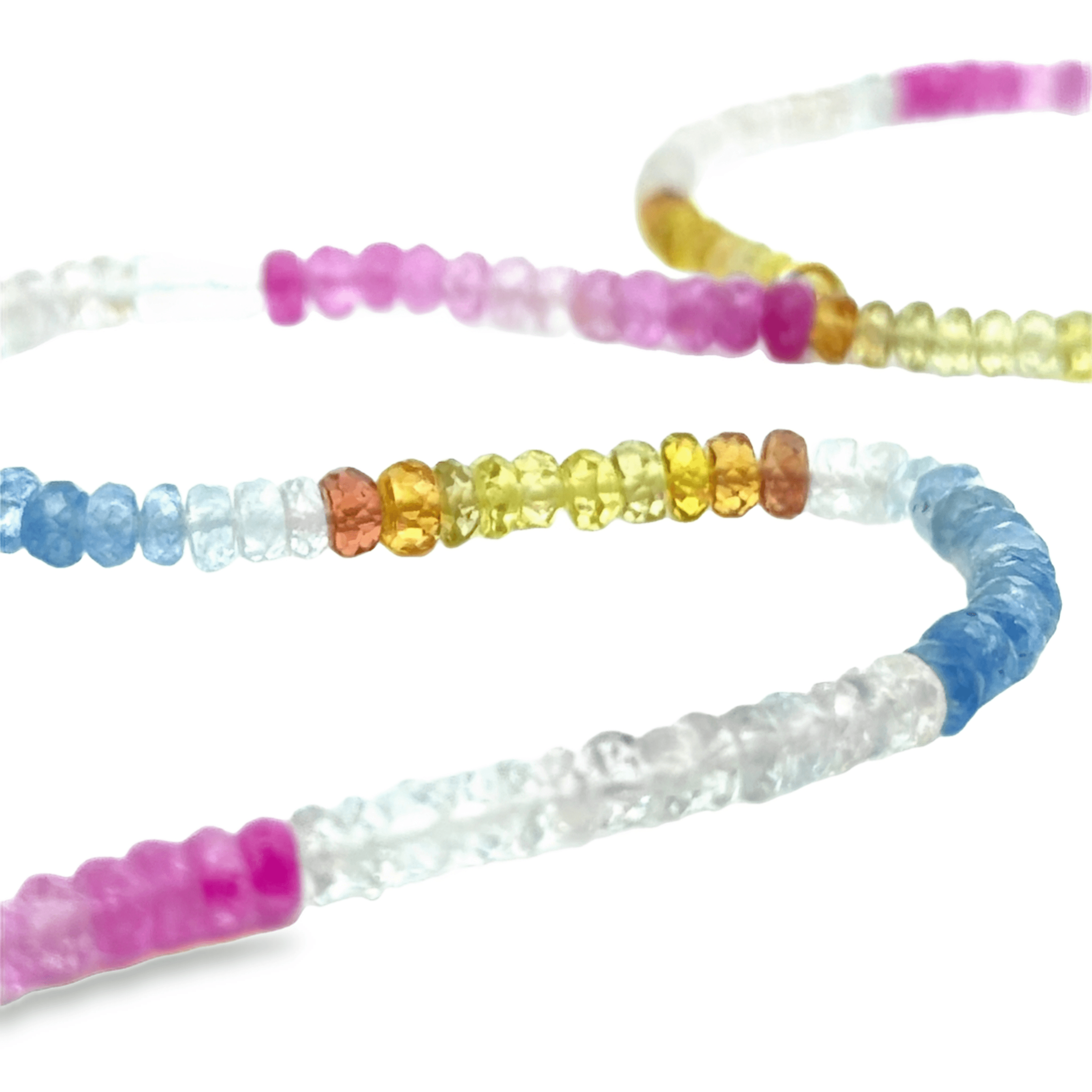 Colorful beaded sapphire necklaces on a white background