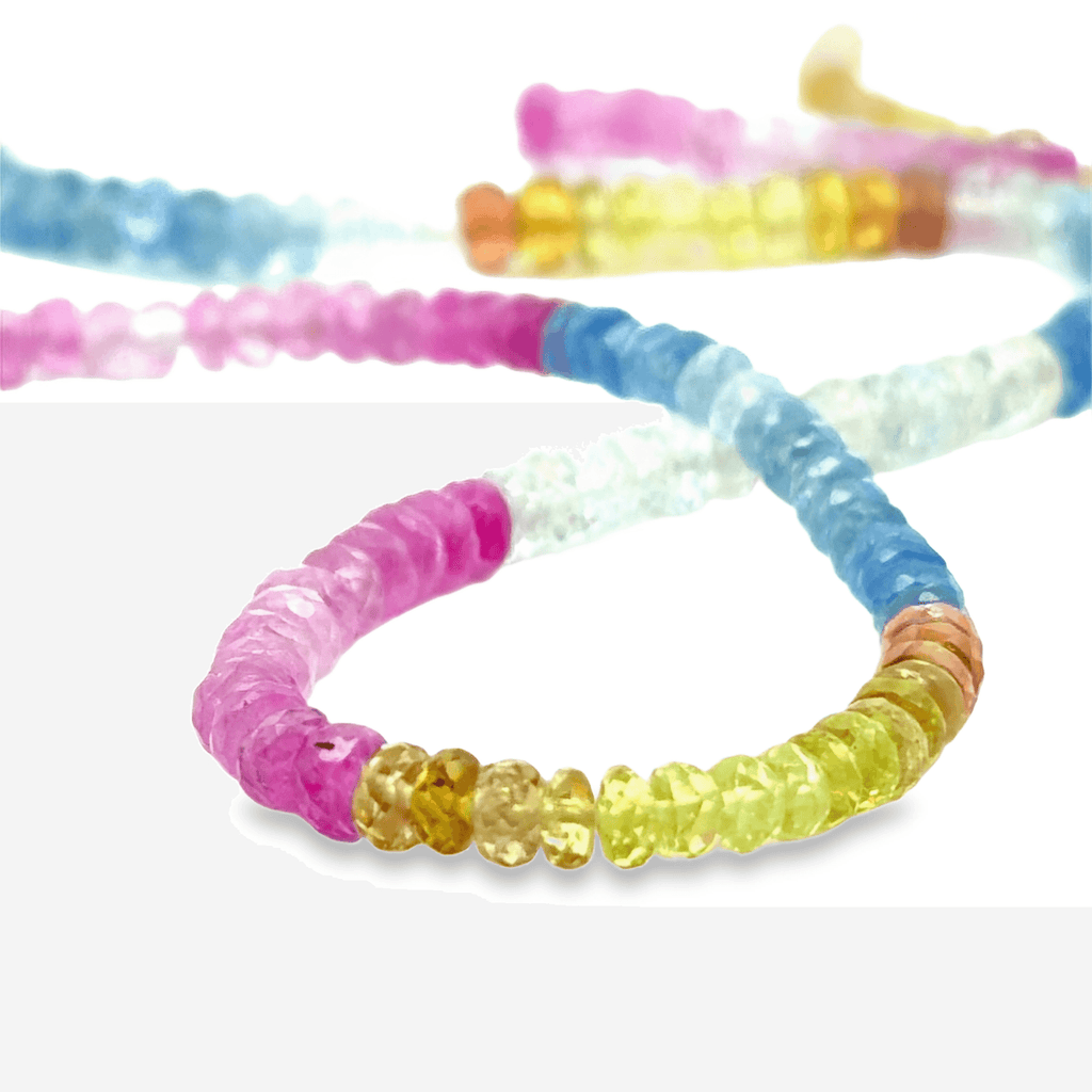 Colorful beaded sapphire necklace on a white background
