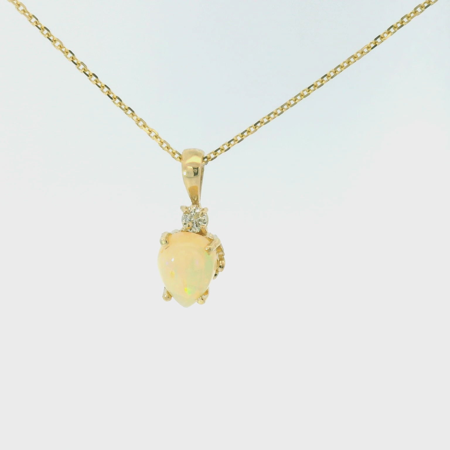 Opal and diamond pendant