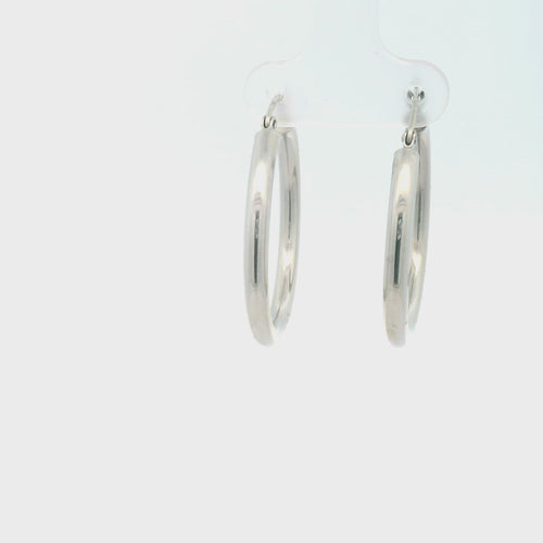 White gold hoop earrings on a white background