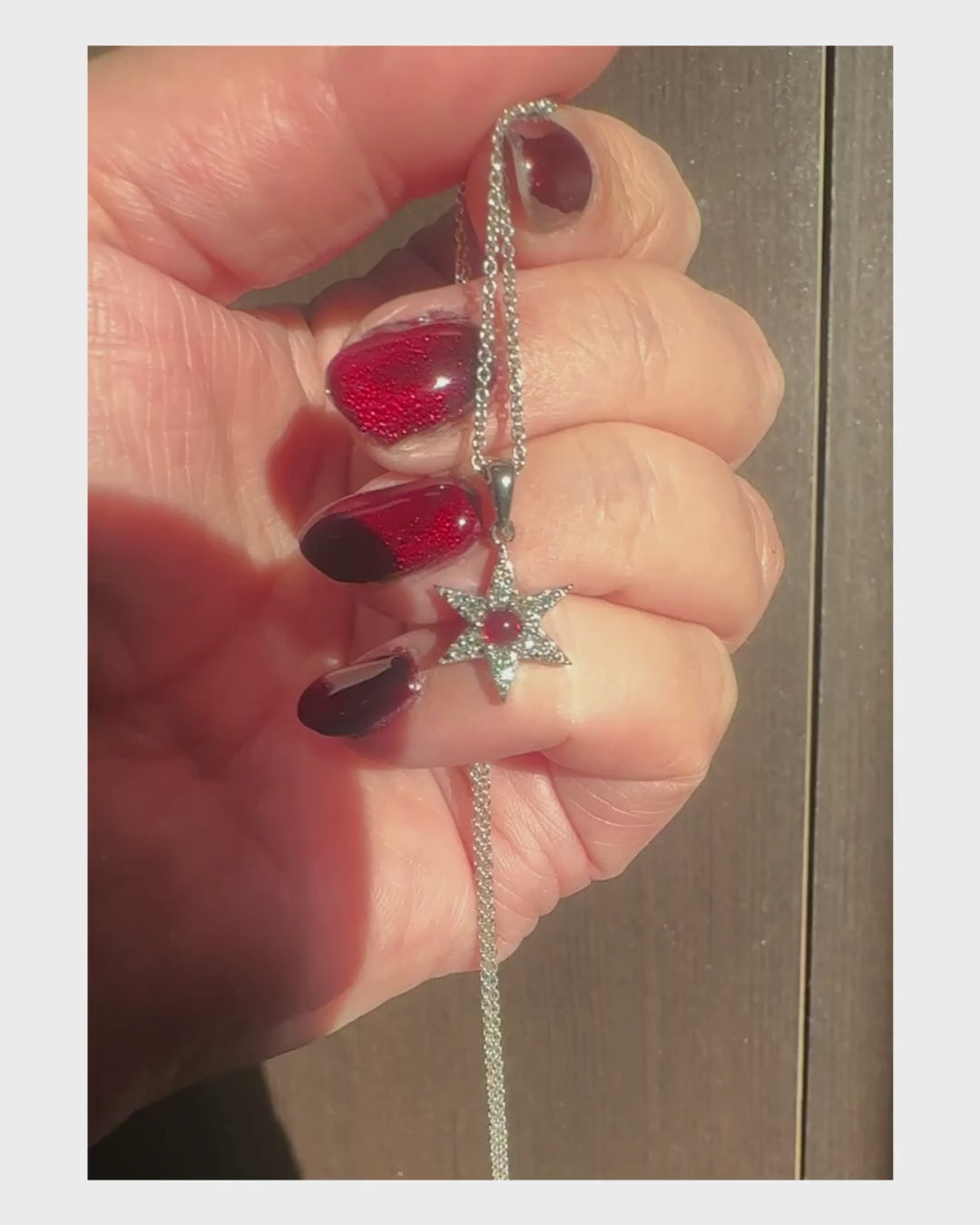 Star burst diamond and garnet pendant